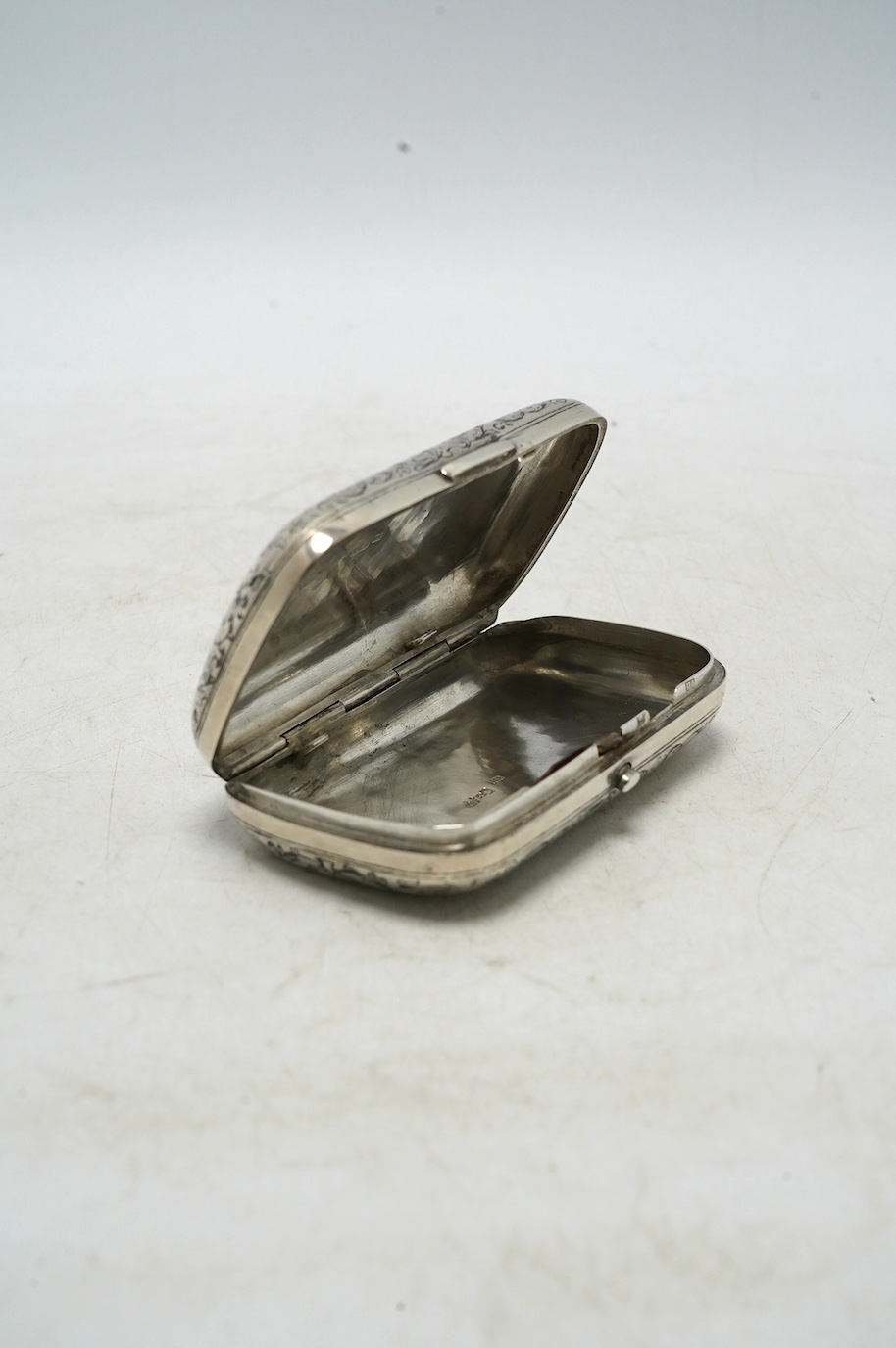 A late 19th century Russian 84 zolotnik and niello ovoid snuff box, Moscow, 1879, 96mm, gross 104 grams. Condition - poor to fair